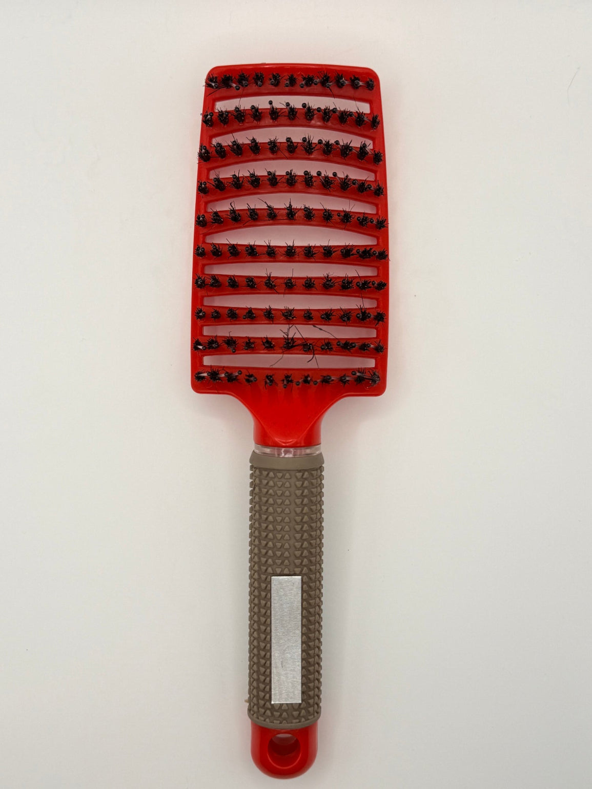 Red sensory hair brush.