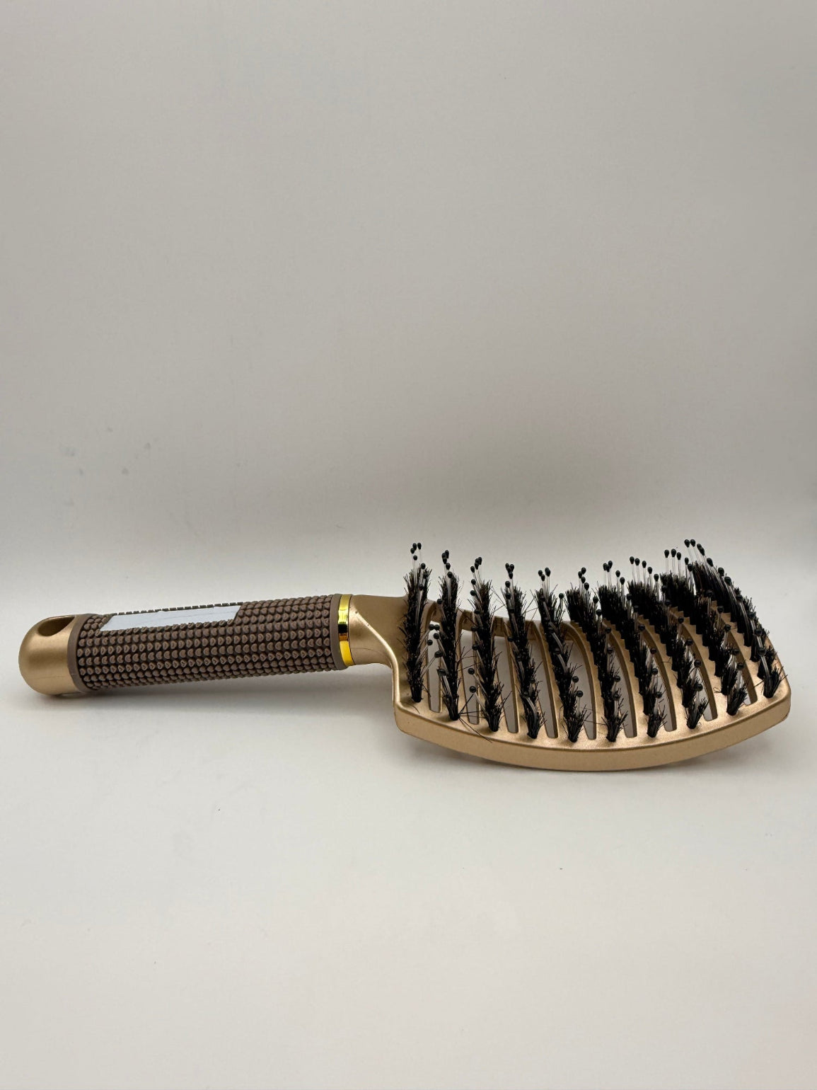 Gold sensory hair brush.