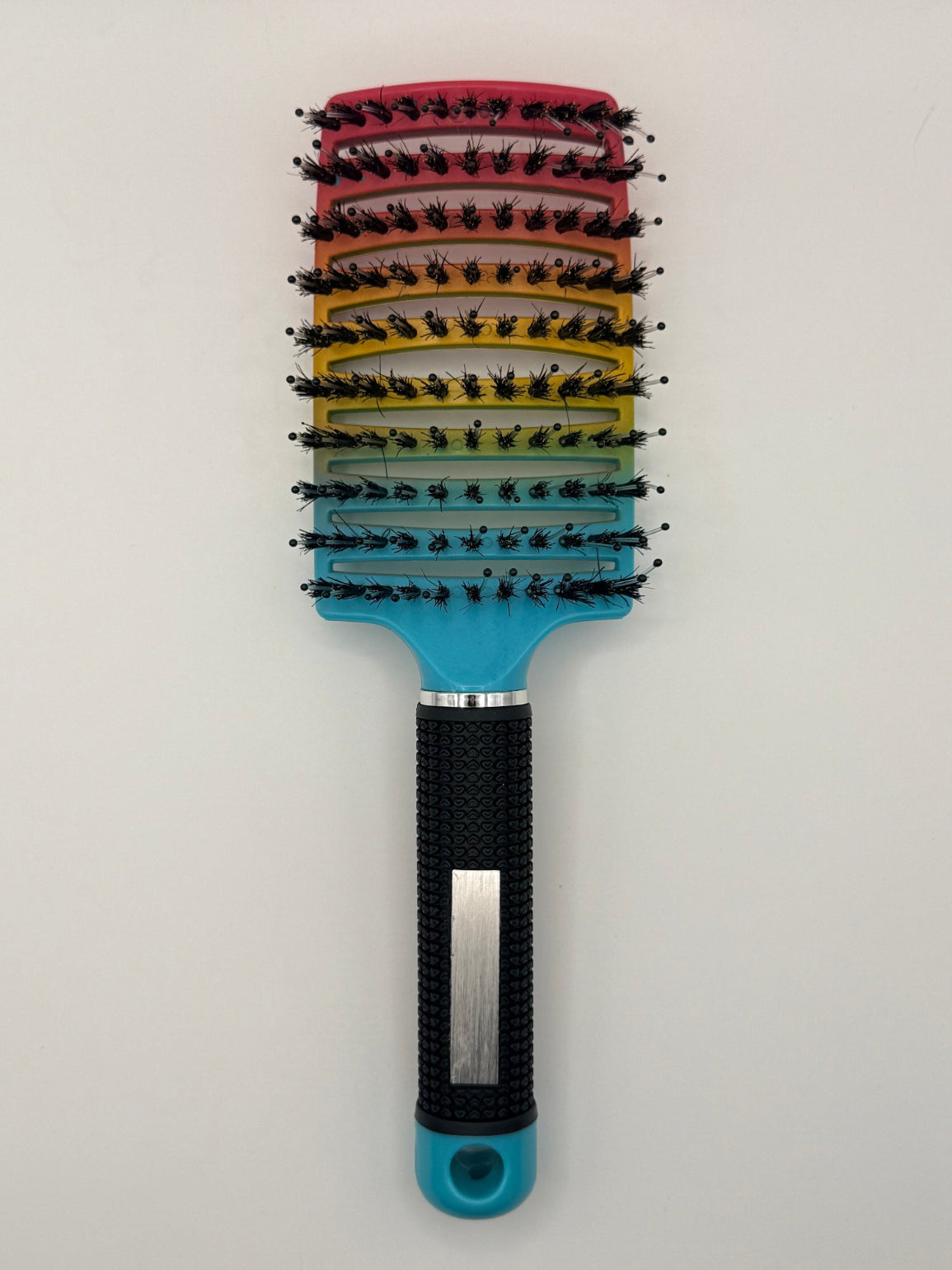 Rainbow sensory hair brush.