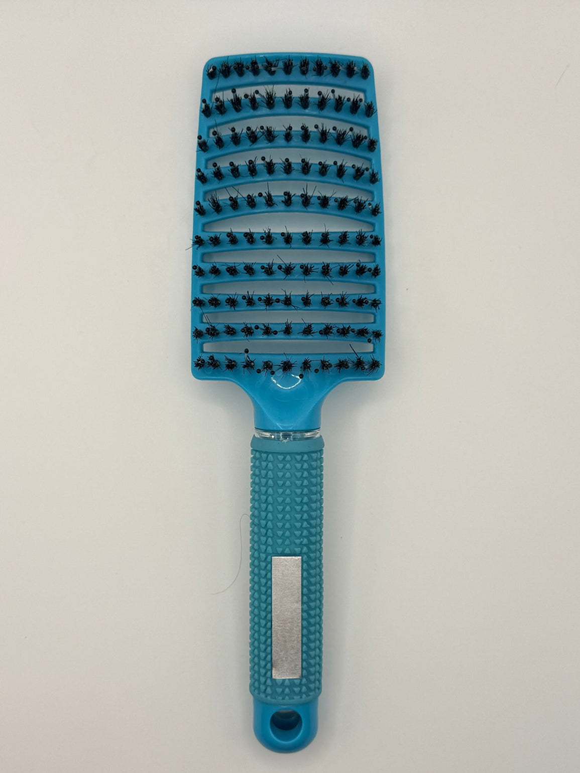 Blue sensory hair brush.