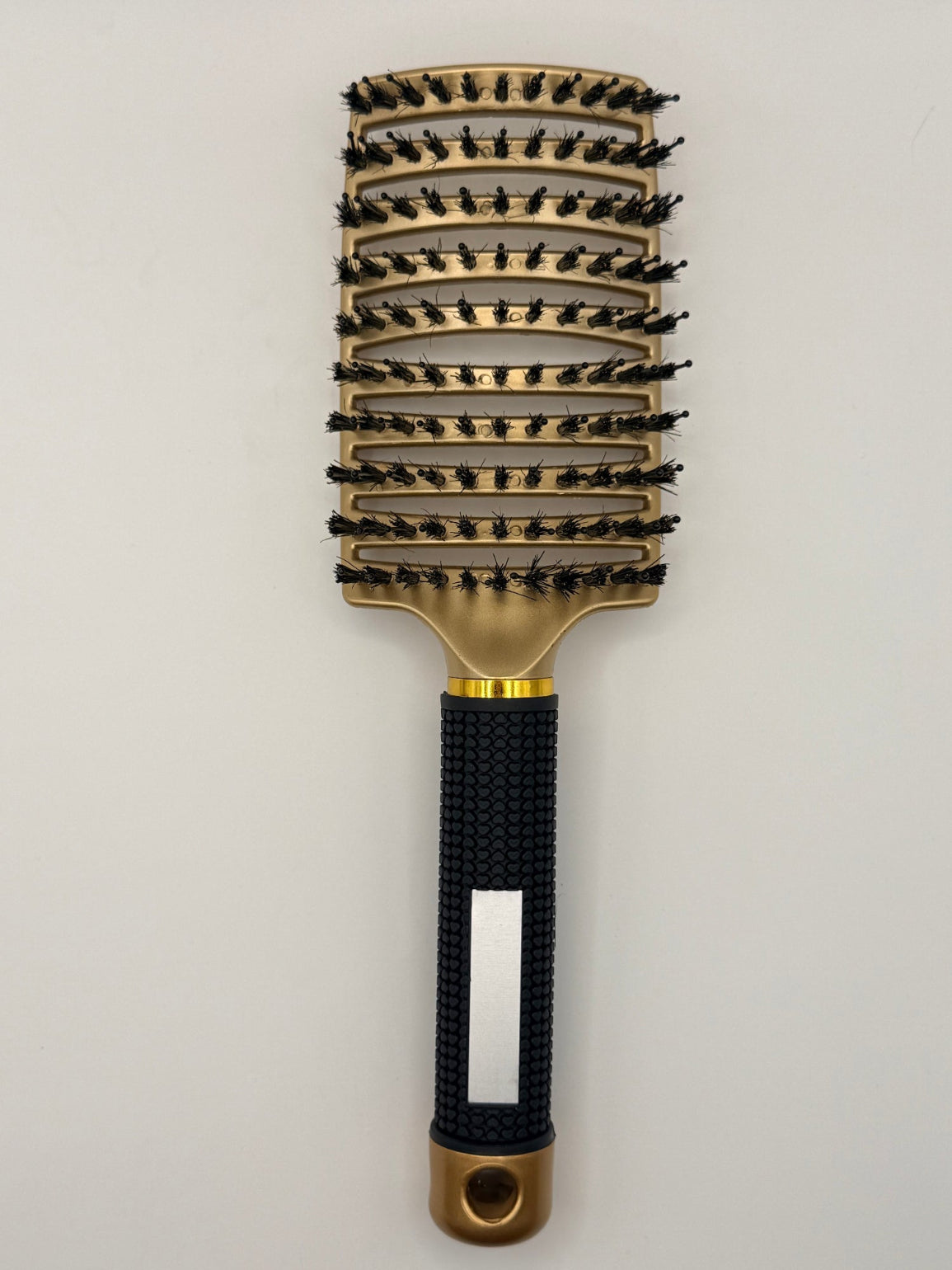 Gold sensory hair brush.