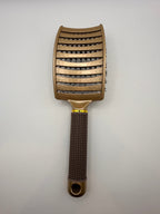 Gold sensory hair brush.