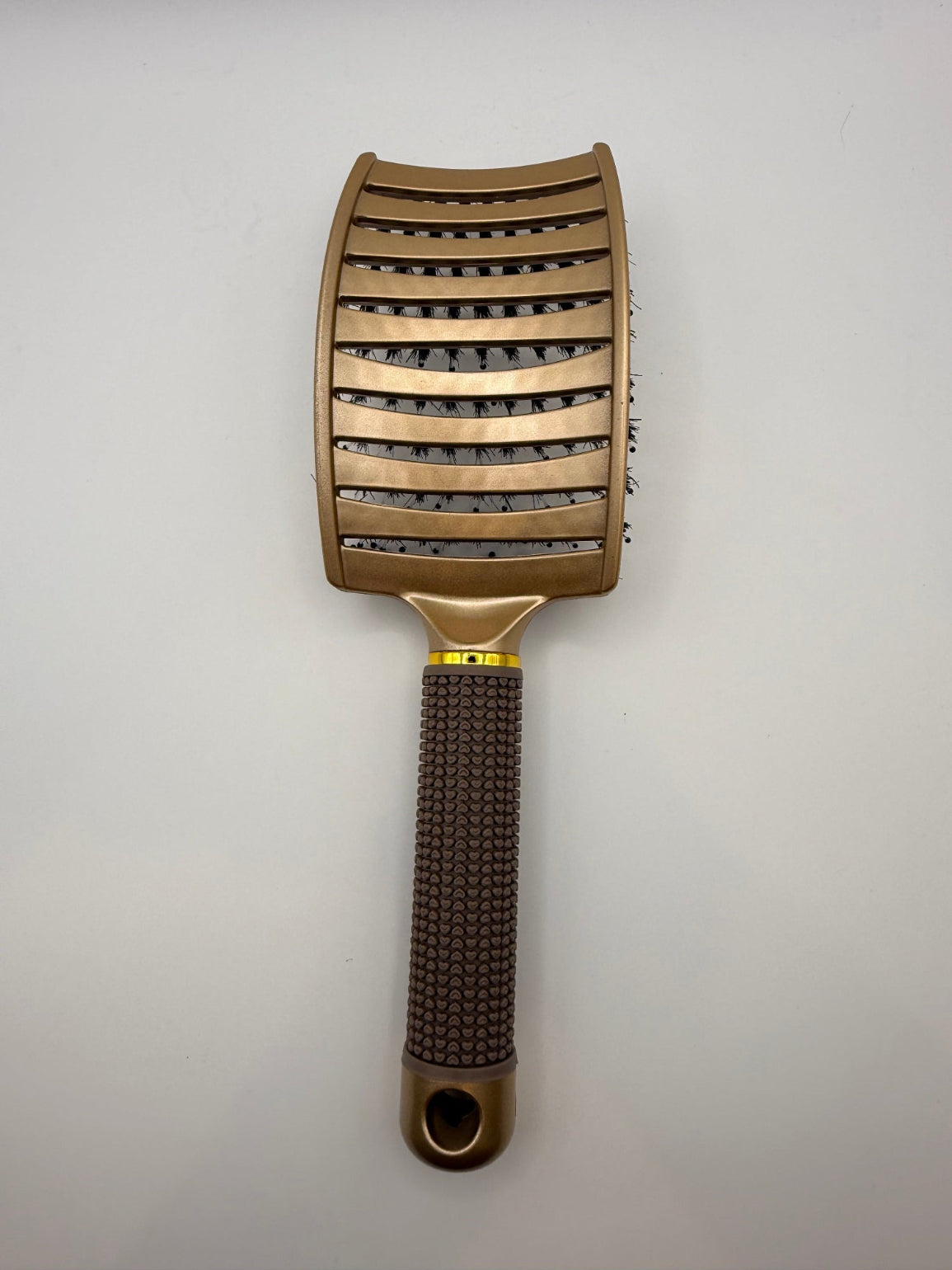 Gold sensory hair brush.
