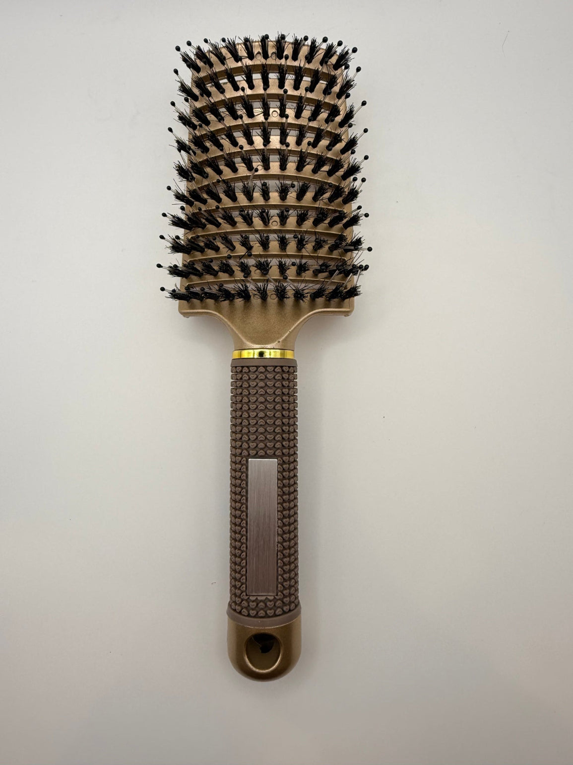 Gold sensory hair brush.