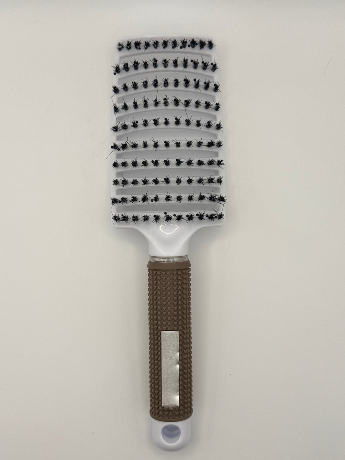 White sensory hair brush.