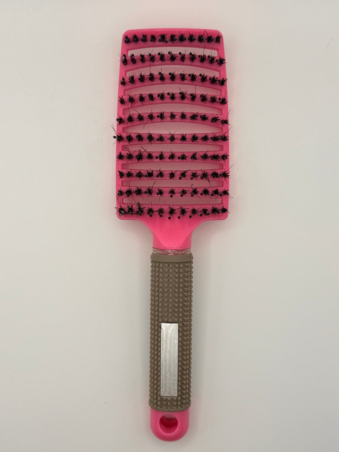 Pink sensory hair brush.