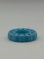 Blue circular ring with star patterns on a gray background