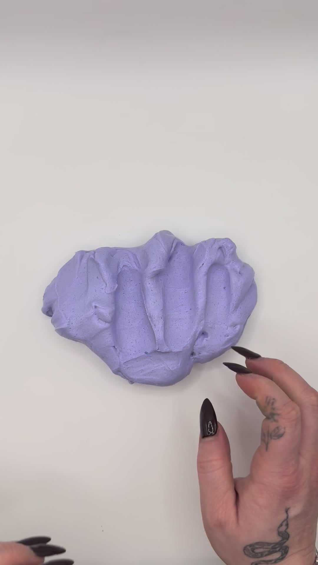 Video of the grape sorbet butter slime in hands.