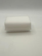 Rectangular white silicone wash brush with sponge.