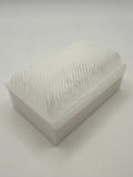 Rectangular white silicone wash brush.