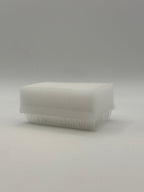 Rectangular white silicone wash brush with sponge.