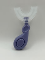 Purple U-shaped sensory toothbrush on a white background.