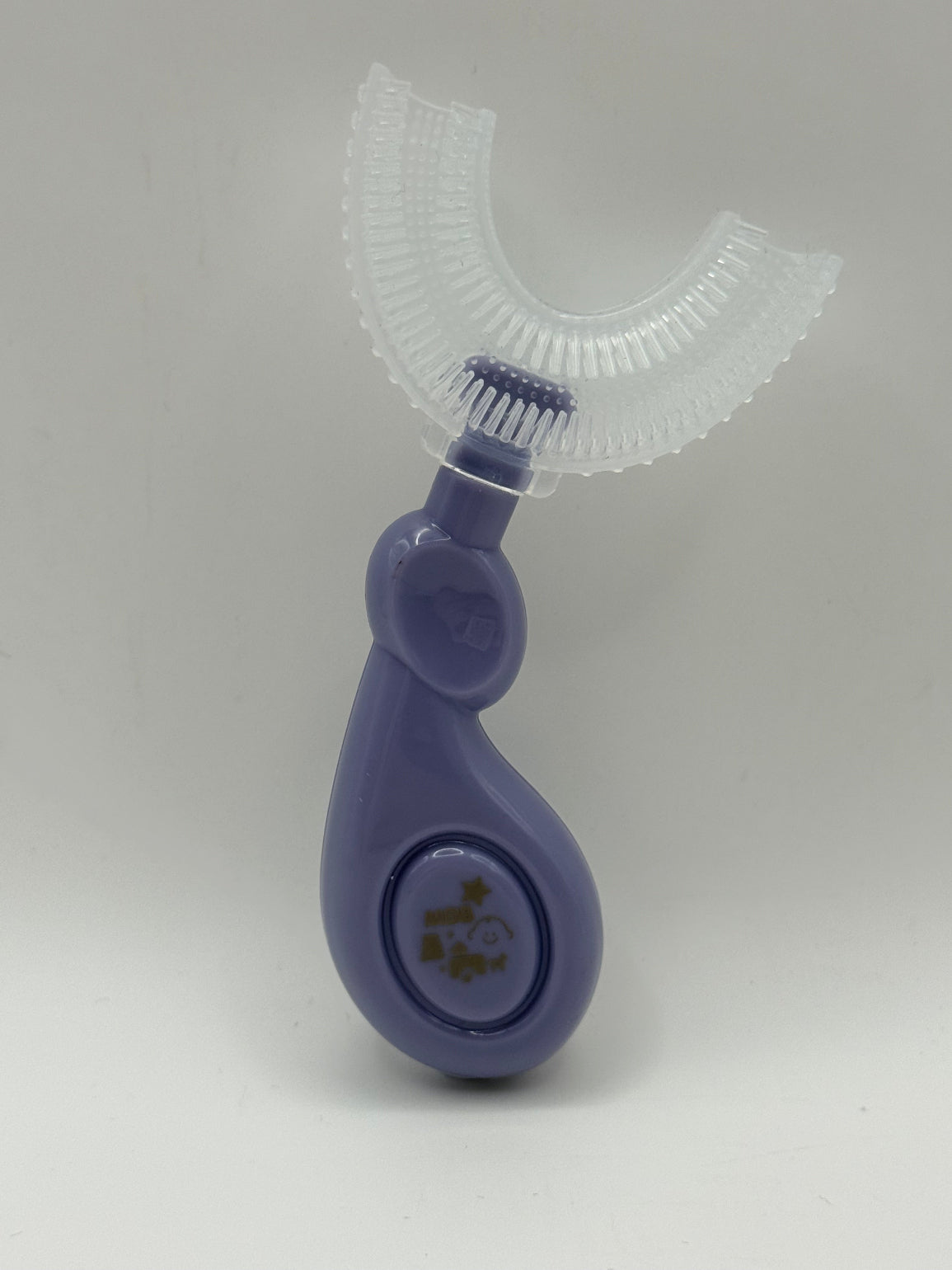 Purple U-shaped sensory toothbrush on a white background.