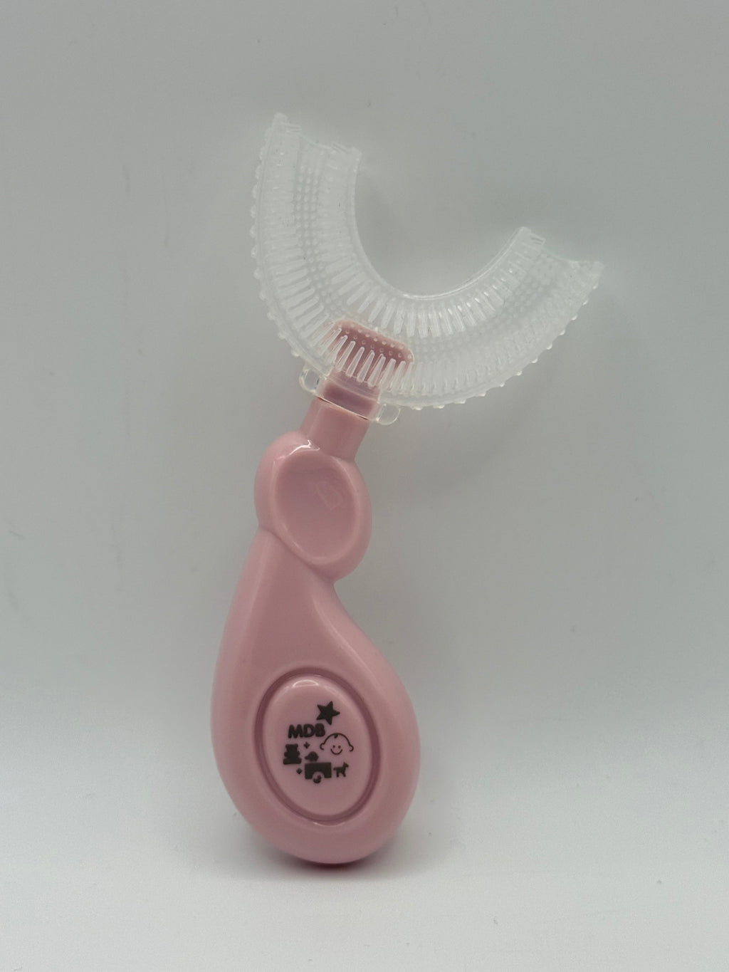 Pink U-shaped sensory toothbrush on a white background.