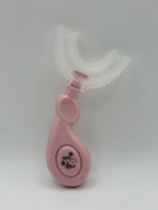 Pink U-shaped sensory toothbrush on a white background.